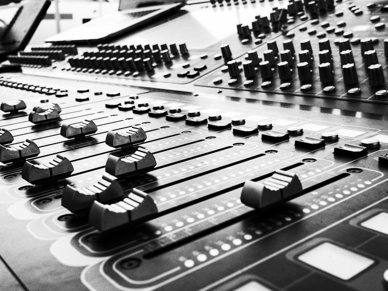 Faders and knobs on a professional audio console